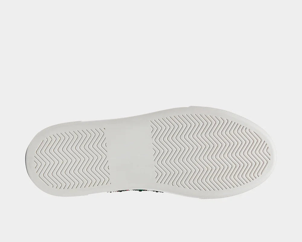 The white outsole with a textured chevron pattern, shown from a top-down view on a light gray background.