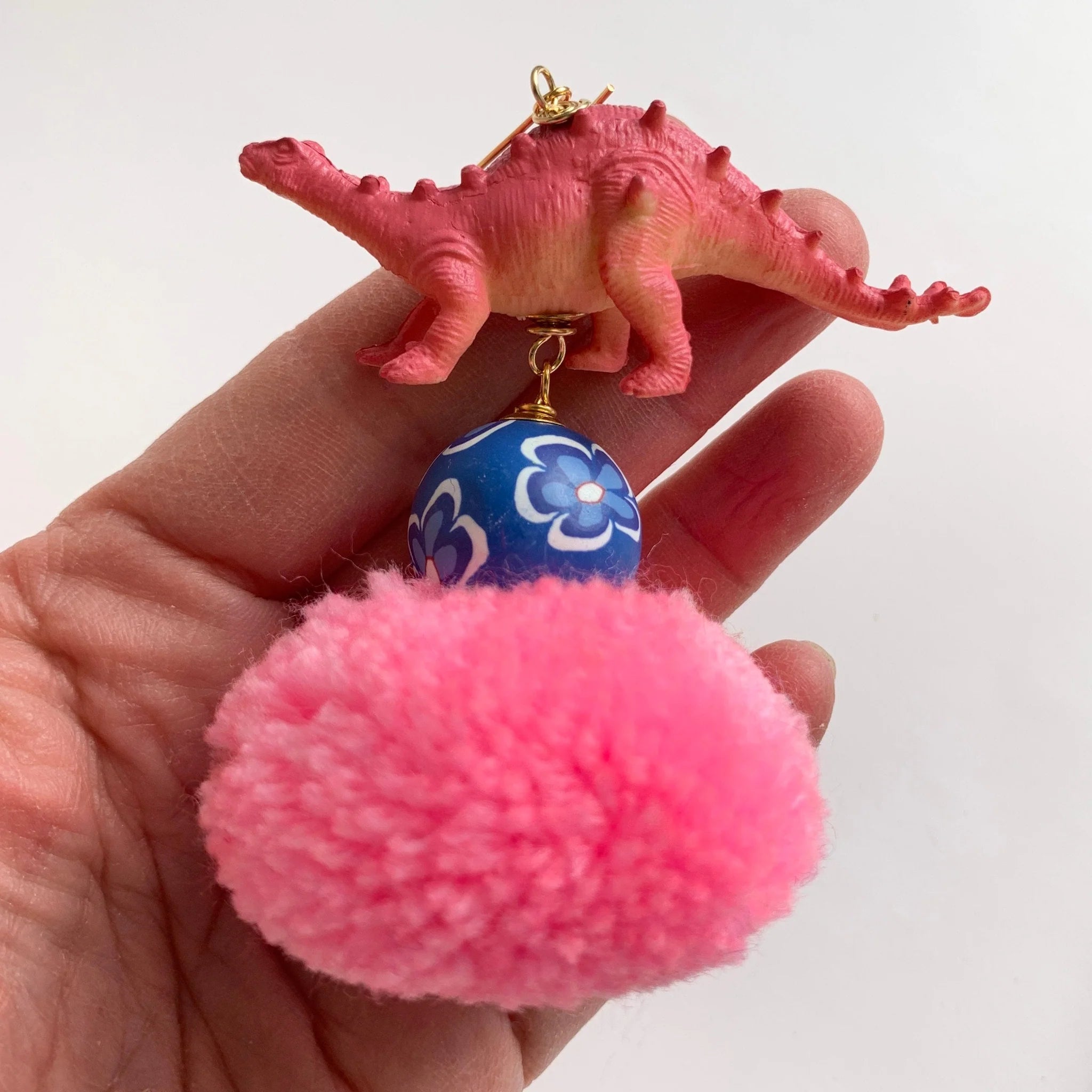 Lenora Dame Pink Pom Pom Dinosaur Earrings